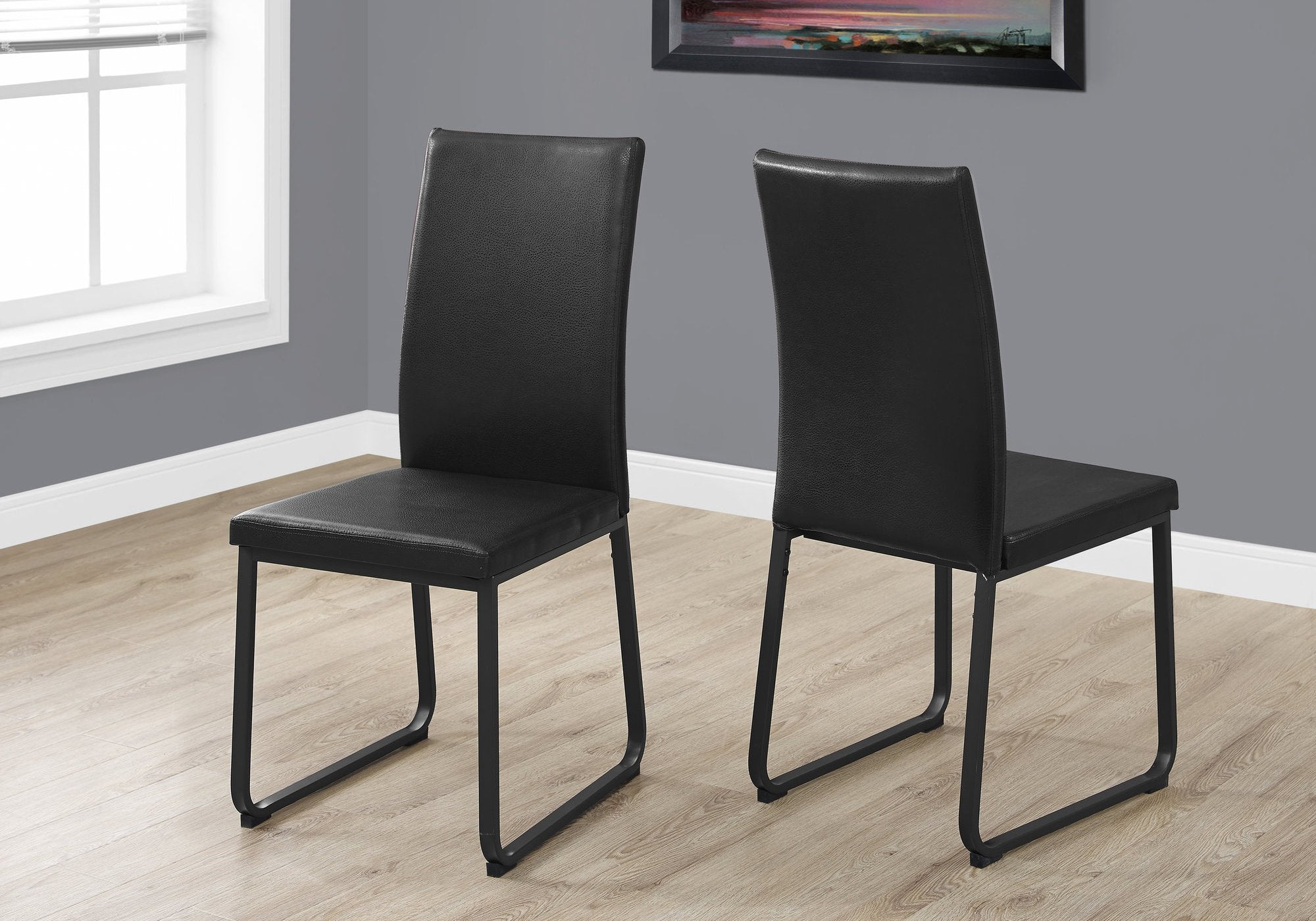 Two 38inches Black Faux Leather and Metal Dining Chairs